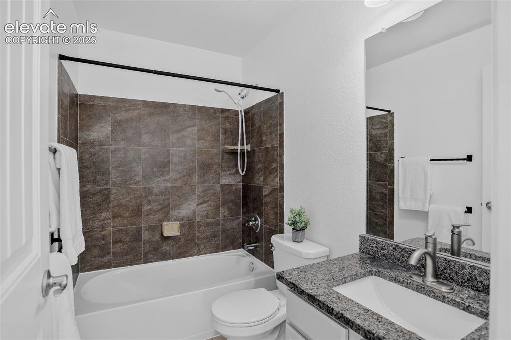 Image 14 of 20: Full guest bath - upper level