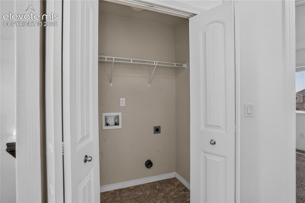 Image 15 of 20: Convenient upper level laundry space
