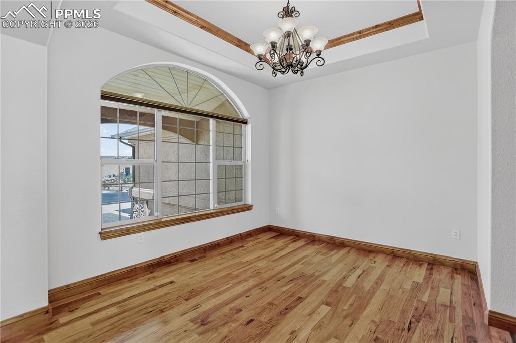 Image 10 of 33: Dining room w/ coffered ceiling