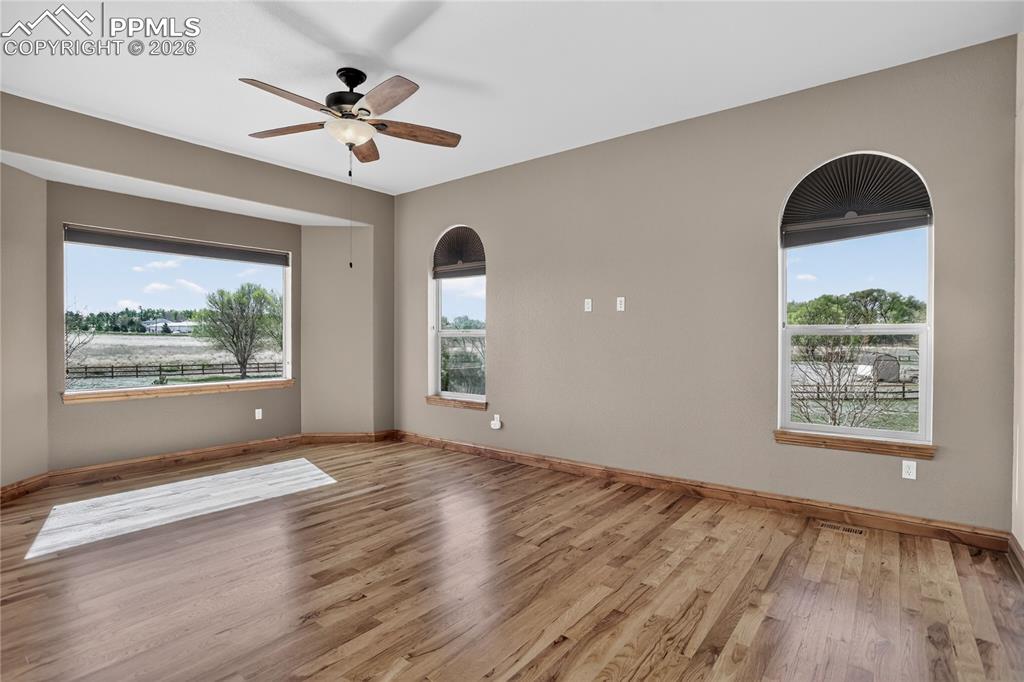 Image 11 of 33: Main-level primary suite