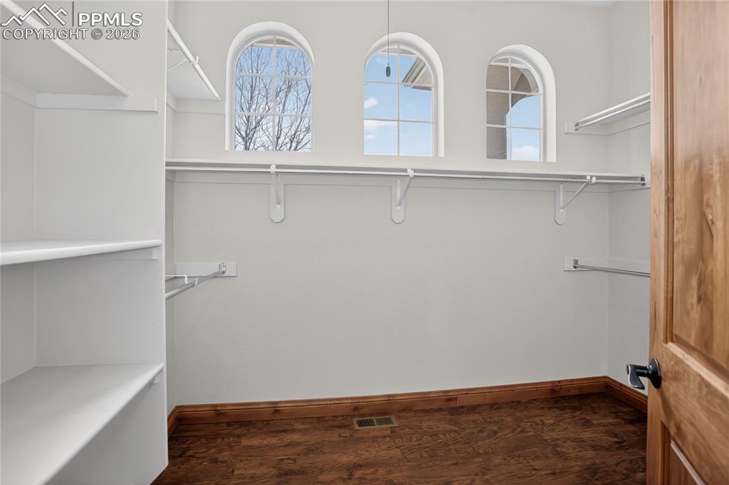 Image 14 of 33: Primary walk-in closet