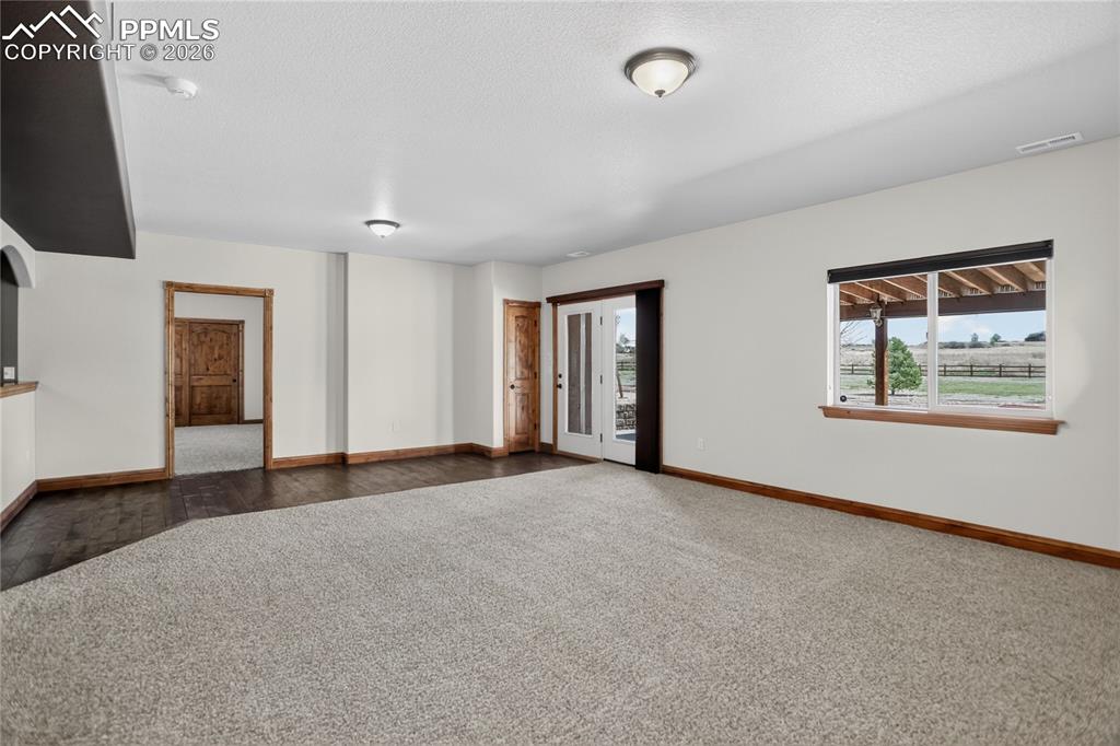 Image 19 of 33: Walk-out family room - lower level