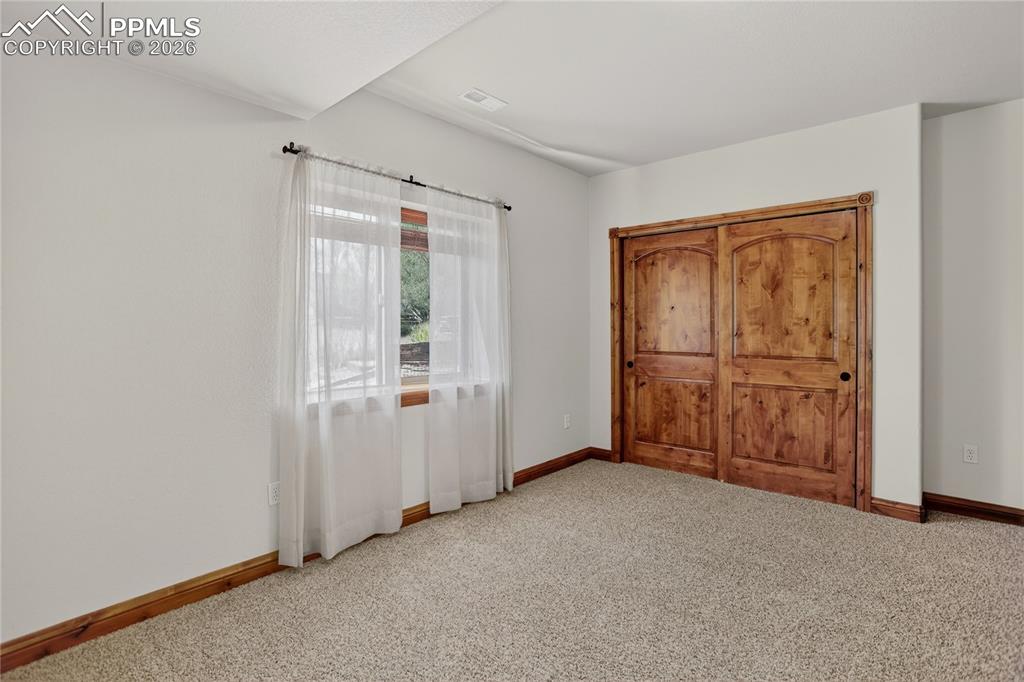 Image 25 of 33: Bedroom 5 - lower level w/ attached bath