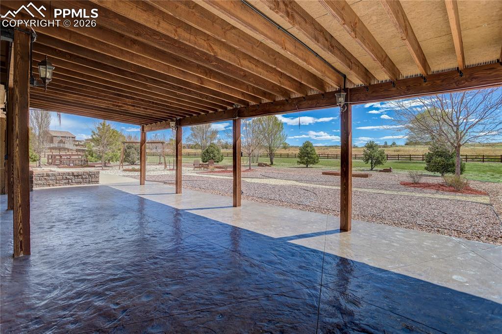 Image 27 of 33: Covered stamped concrete patio