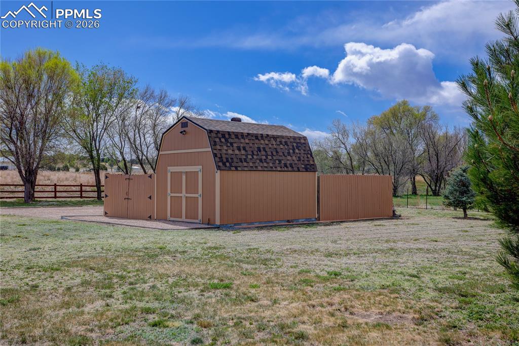 Image 30 of 33: Storage shed