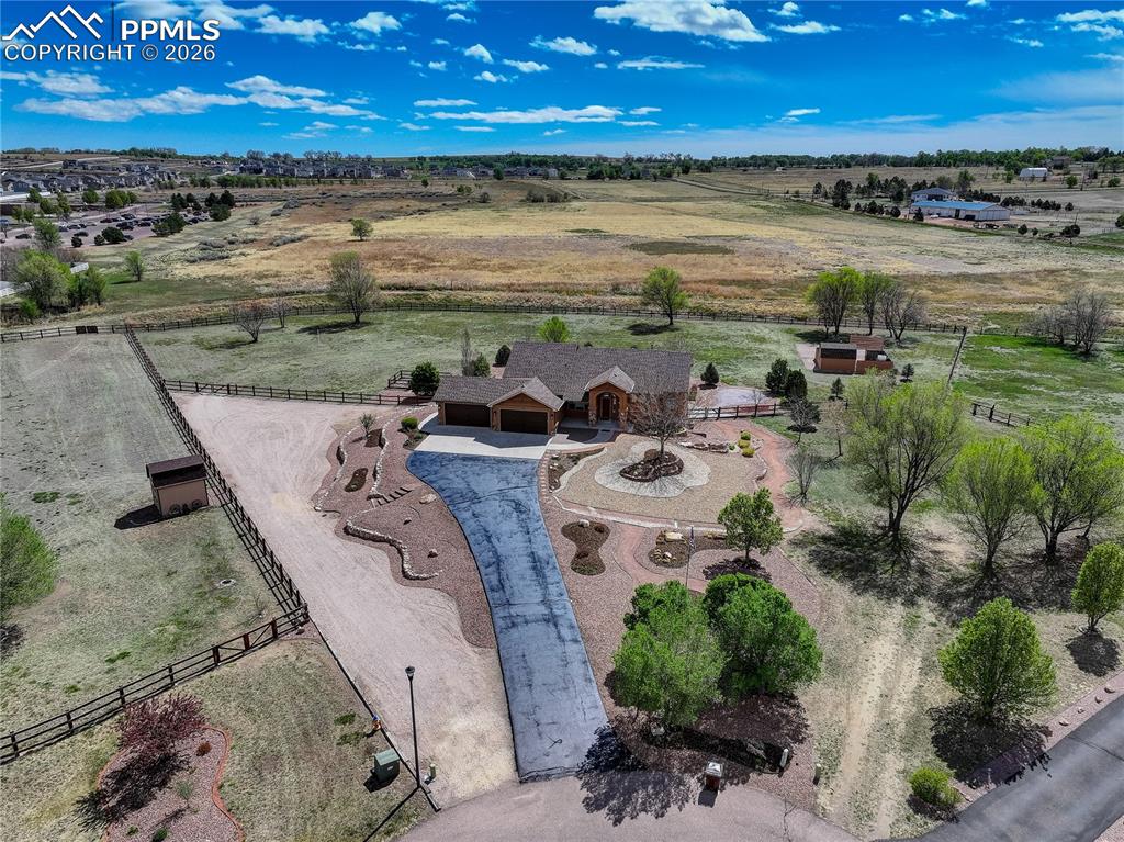 Image 32 of 33: Newly paved driveway & easy maintenance landscaping