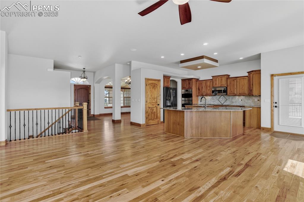 Image 4 of 33: Stunning open concept w/ hickory floors