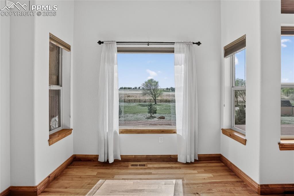 Image 8 of 33: Breakfast nook w/ walk-out to deck