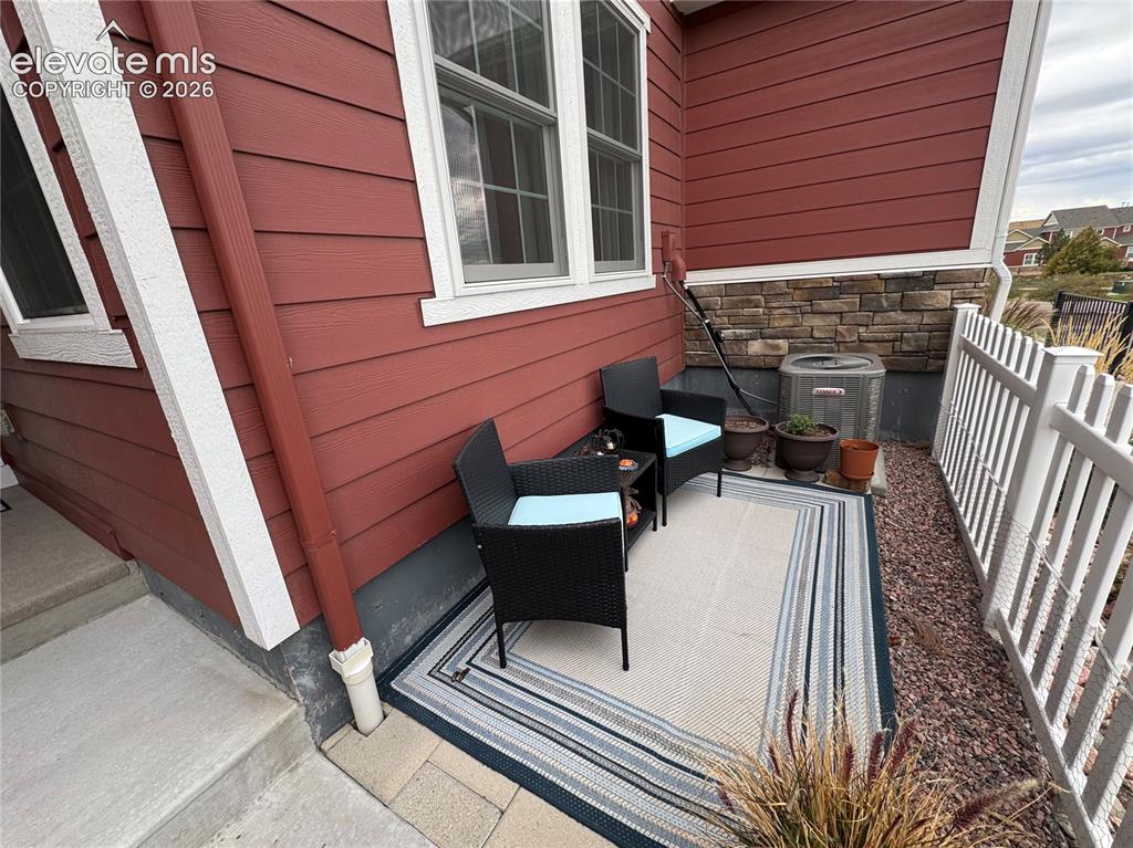 Image 22 of 25: Exterior siding featuring horizontal lap boards and stone veneer accents, m