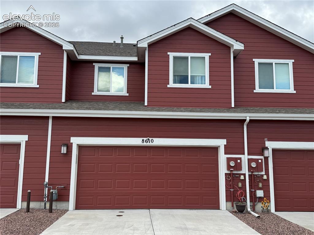 Image 23 of 25: Multi-level exterior featuring horizontal siding, a gabled roofline, slidin