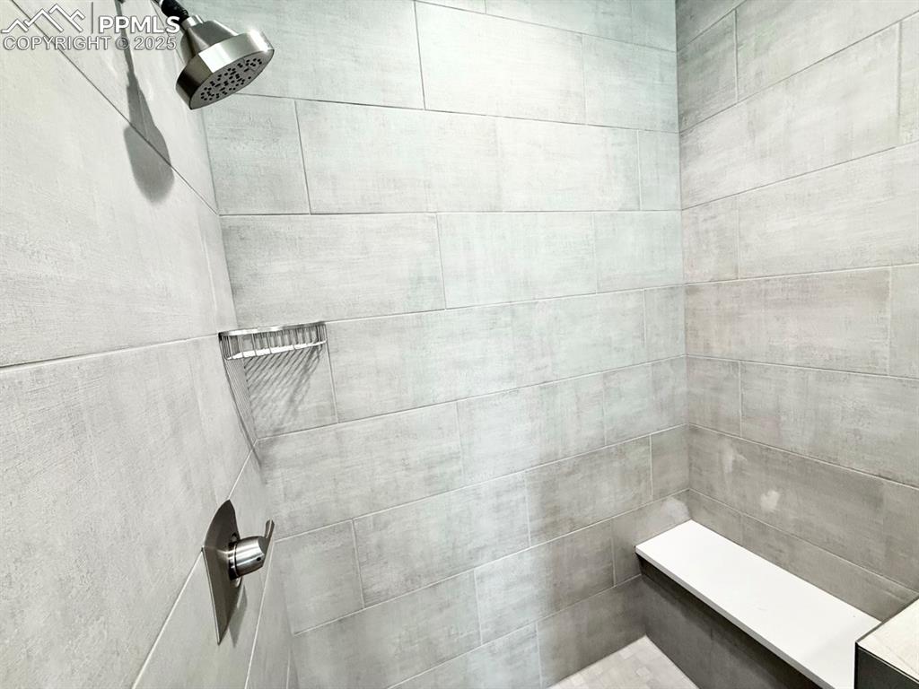 Image 23 of 28: Bathroom view of tiled shower