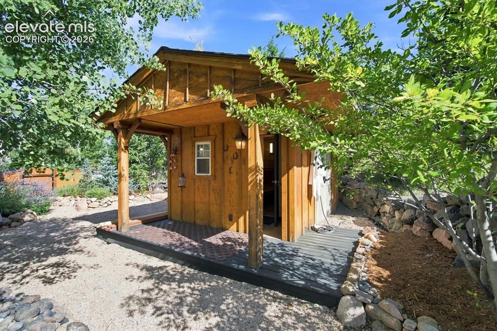 Image 12 of 48: Custom Sauna w outdoor shower