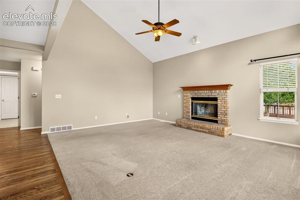 Image 11 of 42: Hall on the left going toward the garage, front door, and main level bedroo