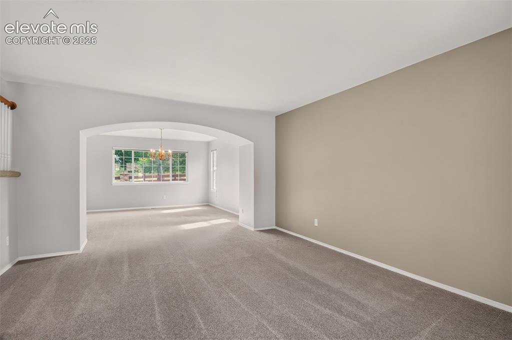 Image 19 of 42: Living Room Looking Into The Dining Room, Newer Carpet and Interior Paint