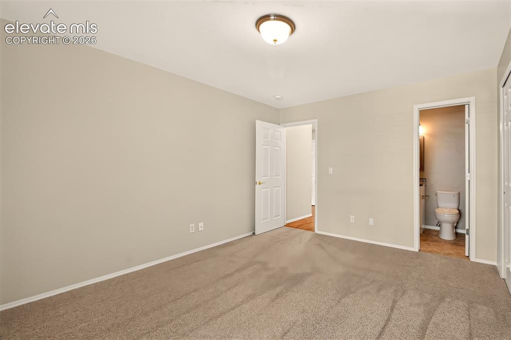 Image 21 of 42: Main Level Bedroom, Bath Attached With Access From The Hall and Bedroom