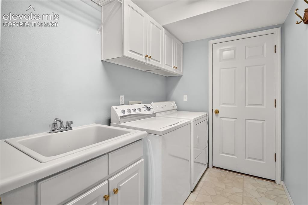 Image 24 of 42: Main Level Laundry, Sin,, Cabinets
