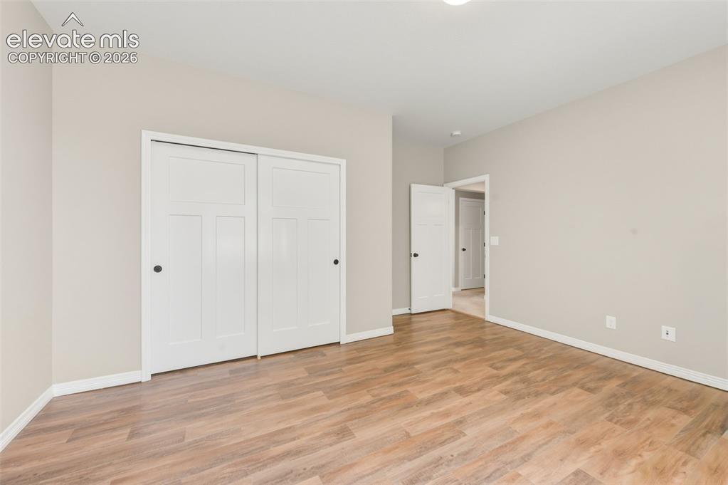 Image 27 of 42: Basement Bedroom with a Dog Door