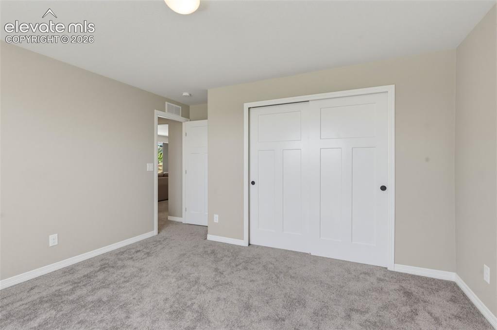 Image 29 of 42: Basement Bedroom