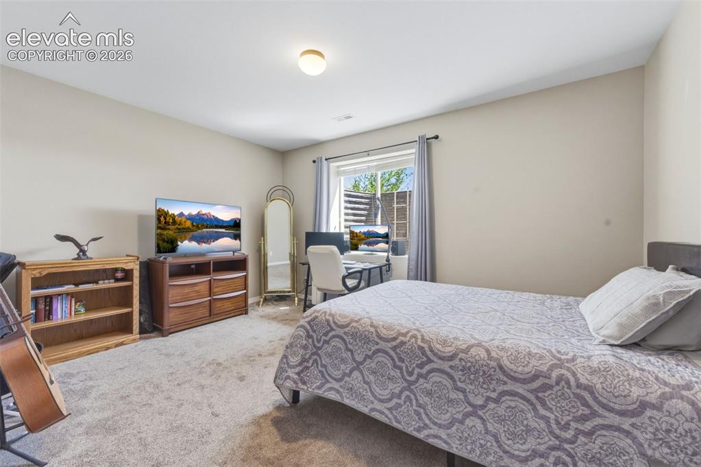 Image 31 of 42: Basement Bedroom