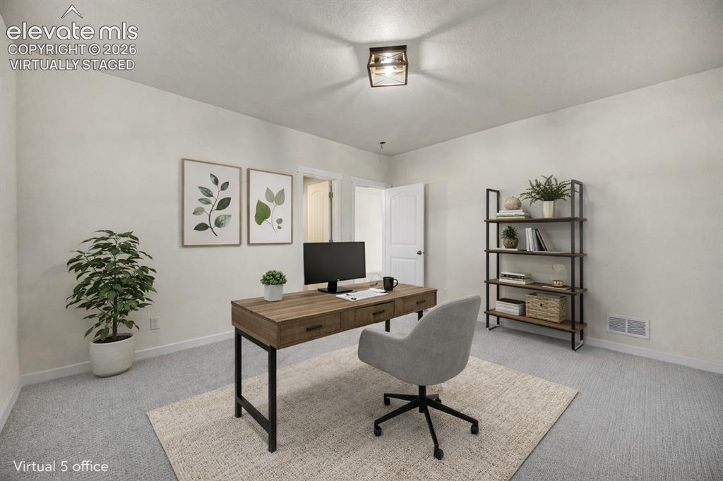 Image 10 of 48: virtually staged Neutral wall paint, textured ceiling, carpeted flooring, a