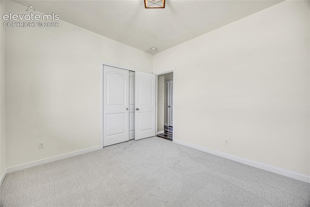 Image 38 of 48: Light-colored carpeting with neutral wall tones