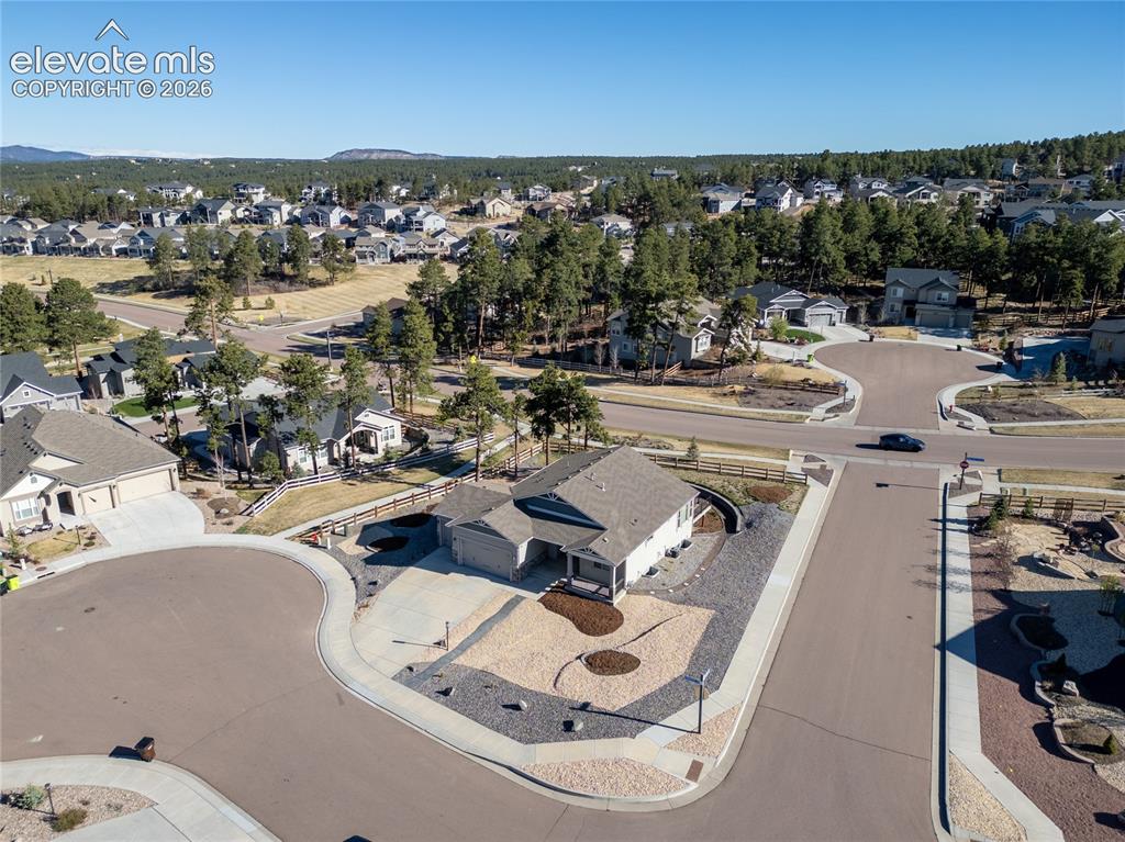 Image 5 of 48: Single-story residence featuring an attached two-car garage, concrete drive