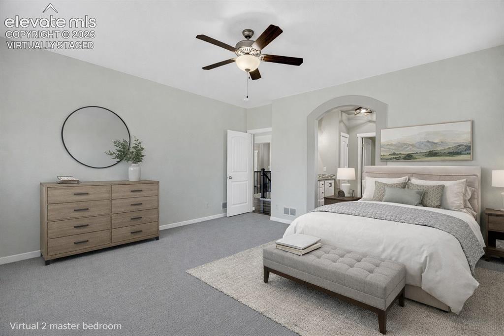Image 7 of 48: virtually staged. Recessed lighting, arched doorway, ceiling fan with light