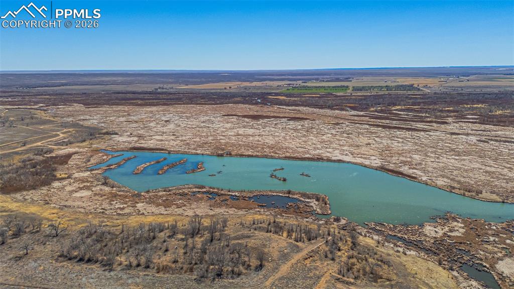 Image 13 of 33: Bedroom featuring light gray walls, a window with blinds, and recessed ligh
