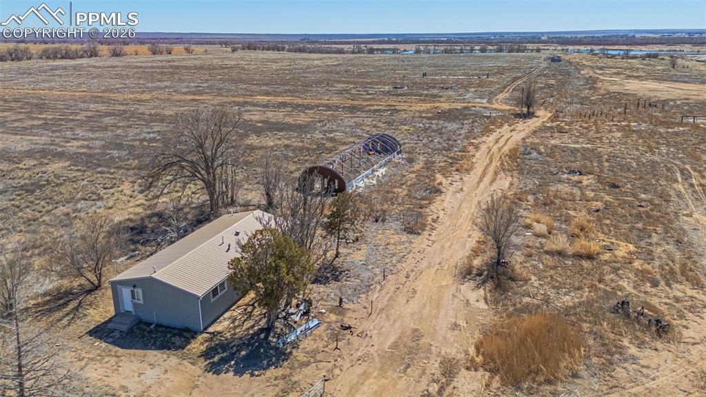 Image 14 of 33: Aerial view of the surrounding landscape, featuring expansive open terrain