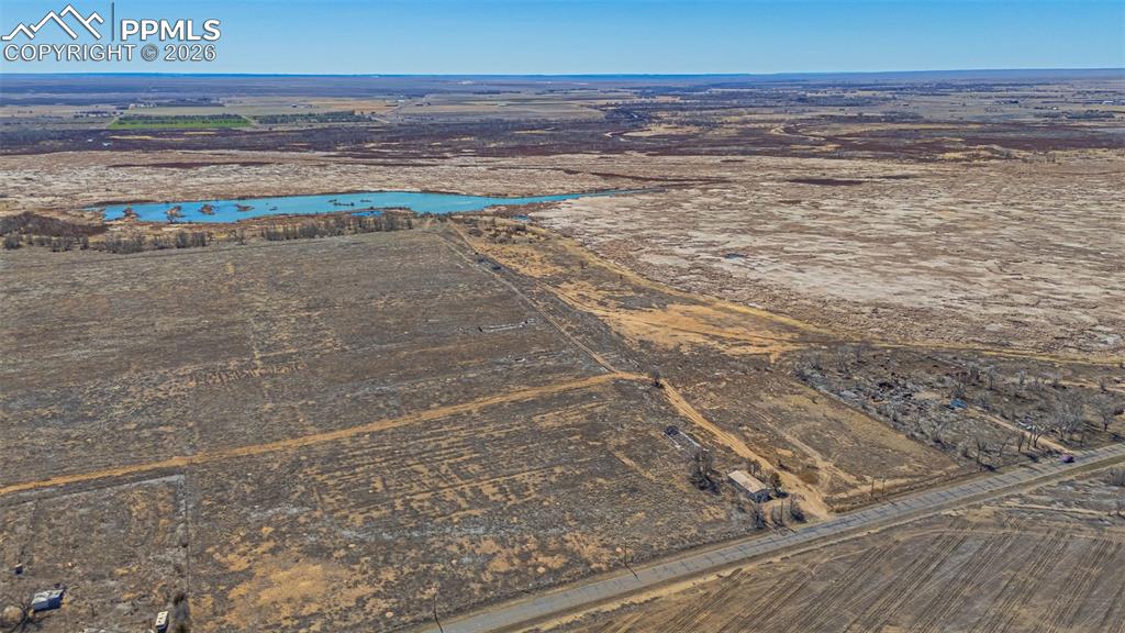 Image 33 of 33: Expansive aerial view showcasing vast undeveloped land