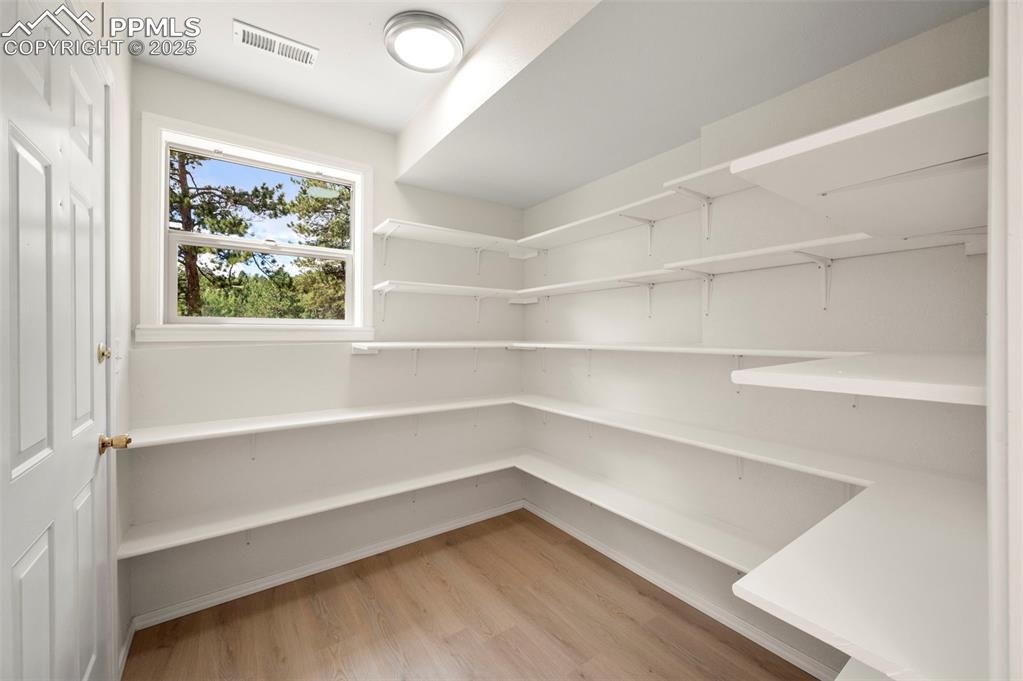 Image 7 of 42: Huge walk in pantry