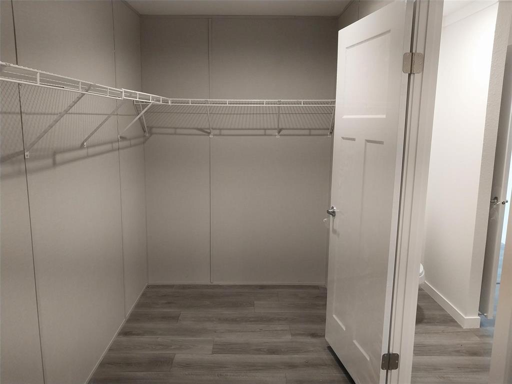 Image 11 of 25: Spacious closet featuring light wood-type flooring
