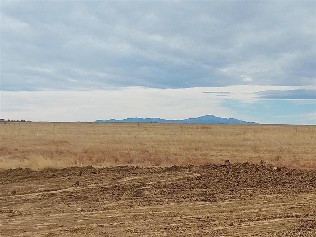 Image 18 of 25: View of mountain background with rural landscape