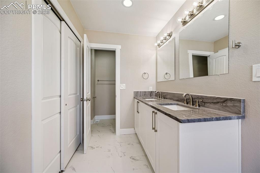 Image 12 of 45: Primary Bathroom, double vanity