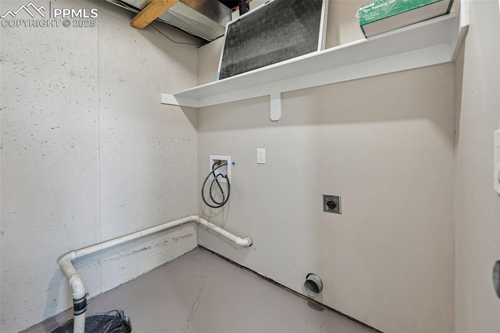Image 34 of 45: Laundry room, sump pump, utility room