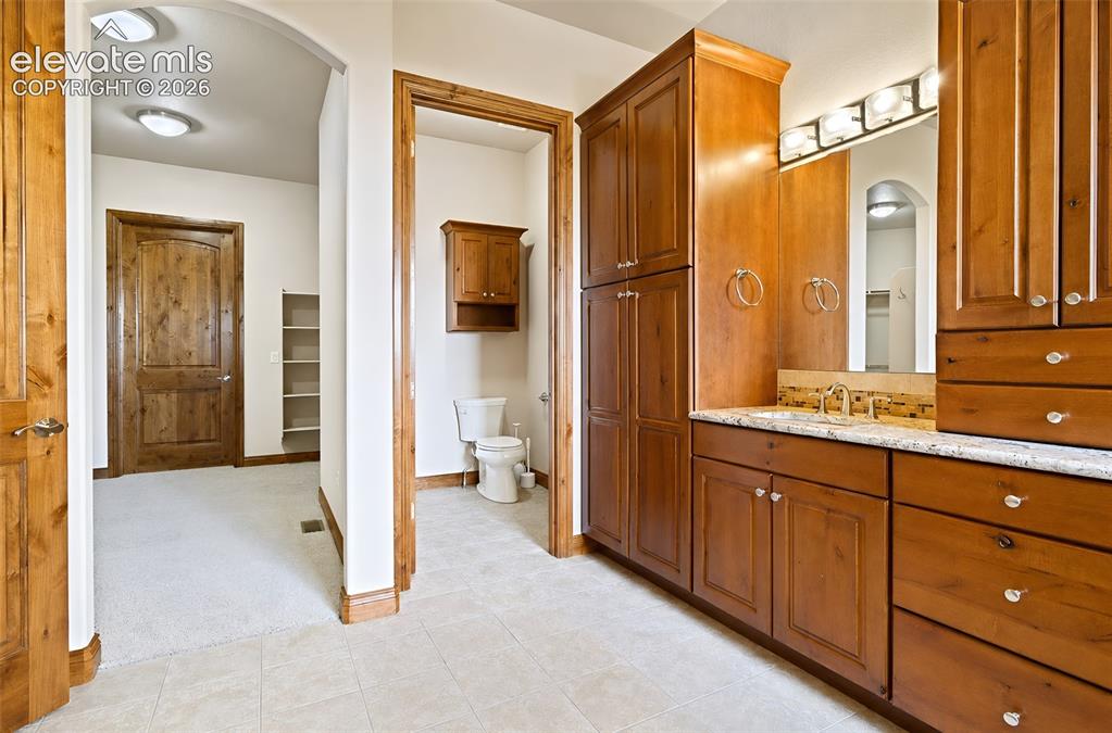Image 27 of 48: Primary bathroom/private water closet