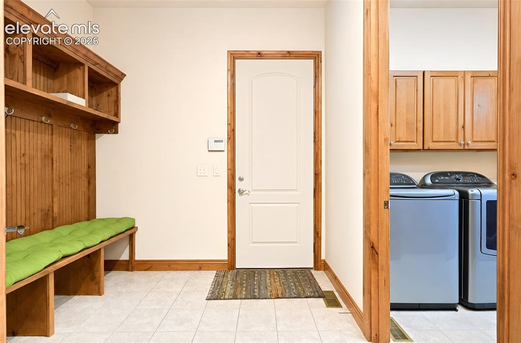 Image 31 of 48: Laundry, mudroom door to 4 car finished garage