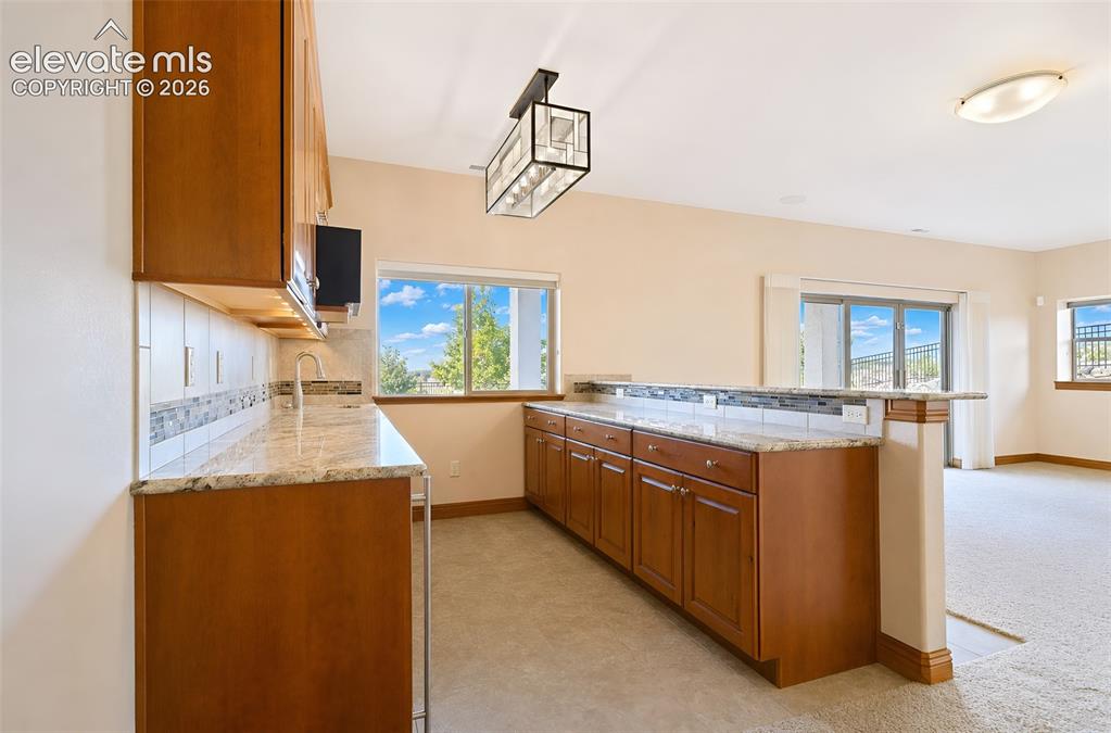 Image 35 of 48: Wet bar at basement