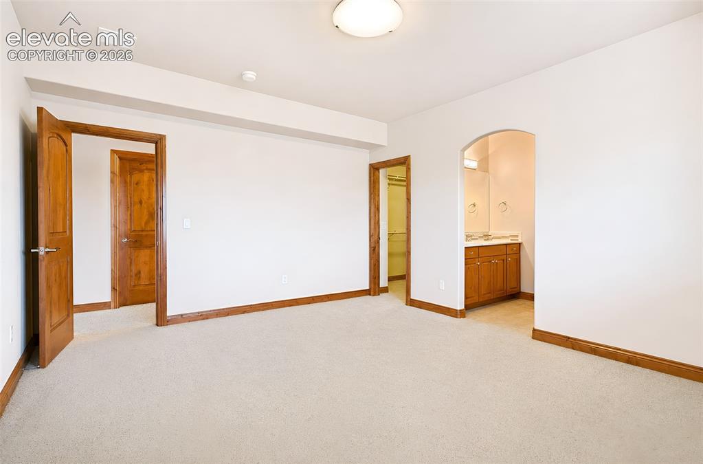 Image 37 of 48: Basement bedroom #1 with walk in closet (alternate view) - Jack and Jill ba