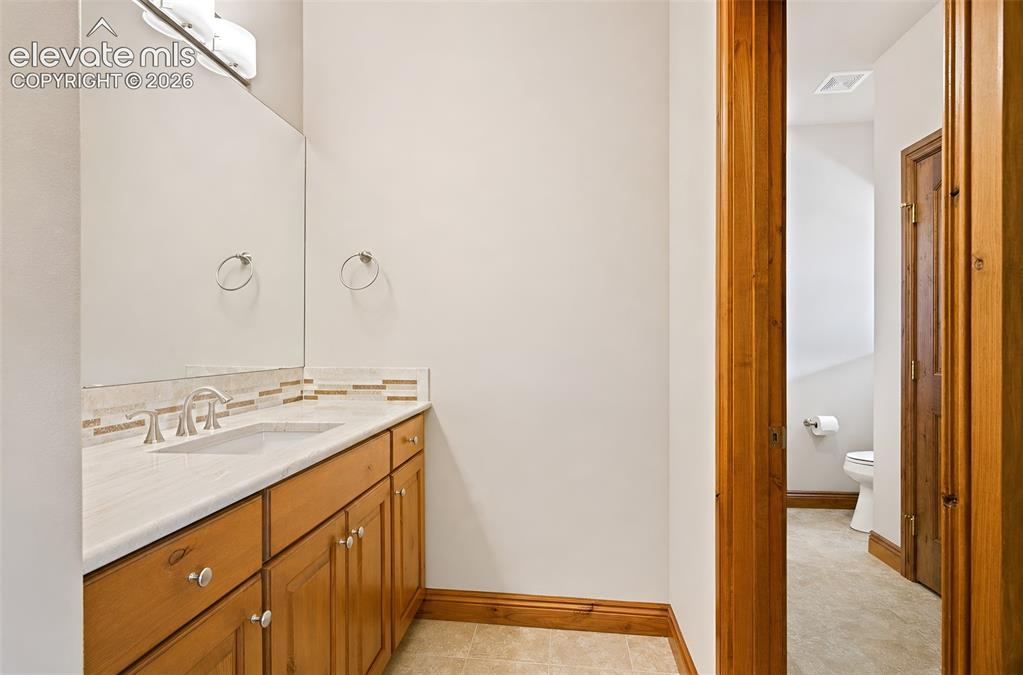 Image 38 of 48: Jack and Jill bathroom at basement bedroom
