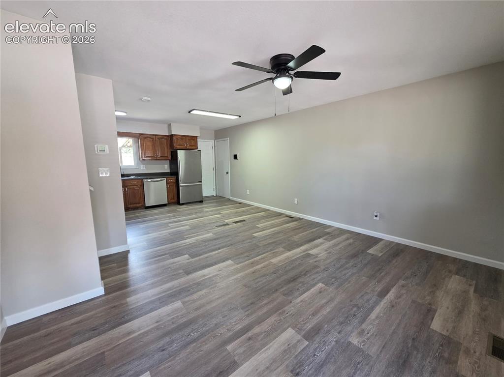 Image 3 of 18: Open-concept layout featuring wood-finish flooring, a ceiling fan with inte