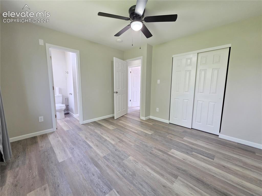 Image 8 of 18: Wood-finish flooring, ceiling fan with integrated lighting, sliding closet 