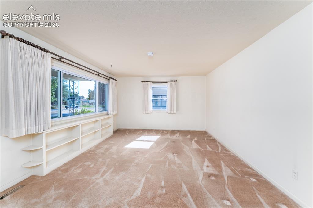 Image 12 of 29: Wall-to-wall carpeting throughout