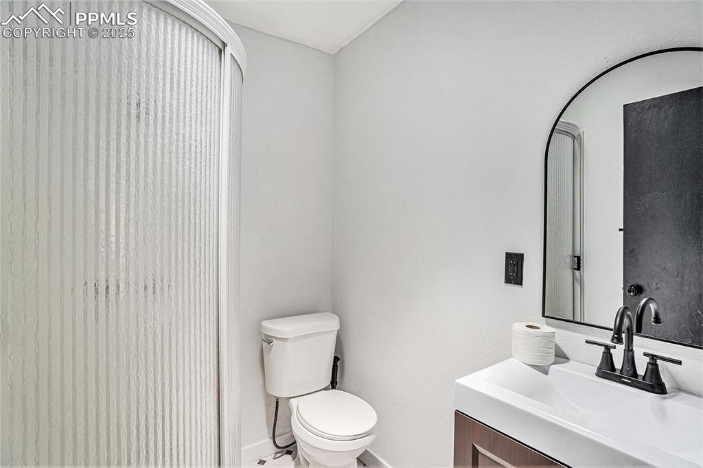 Image 16 of 35: 3/4 bathroom next to kitchen.