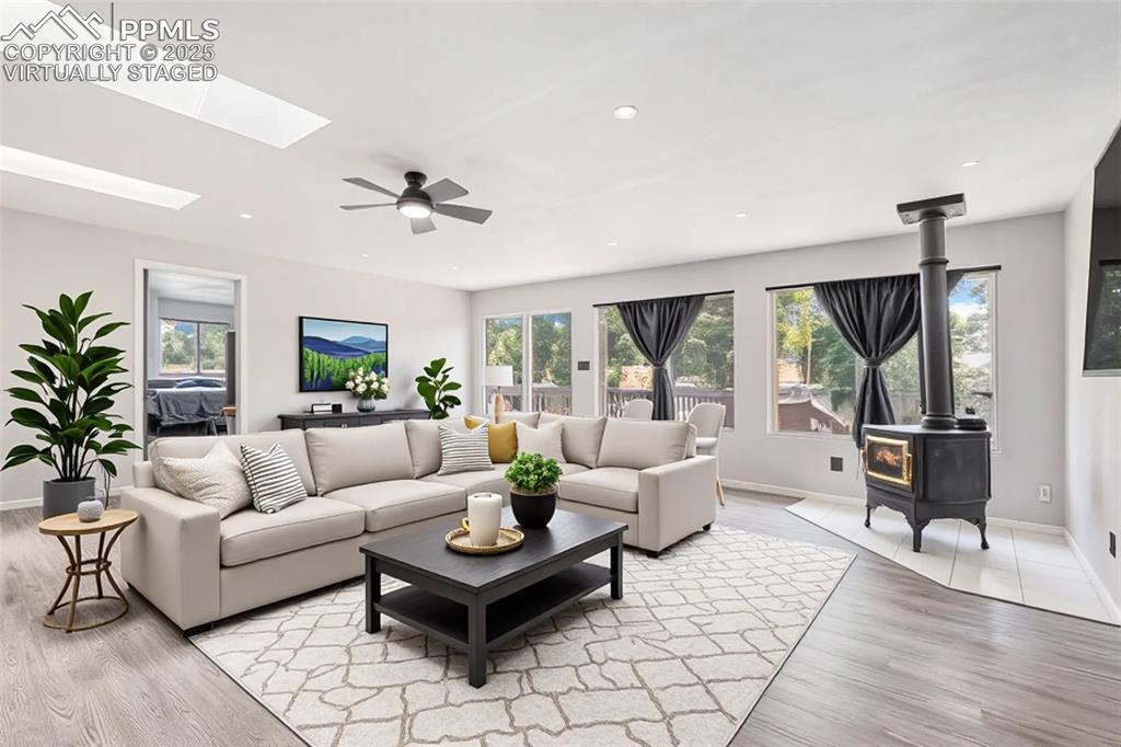 Image 19 of 35: Family room, virtually staged.