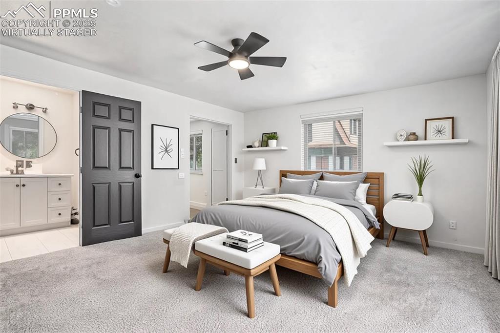 Image 23 of 35: Bedroom with light carpet, connected bathroom, Virtually staged