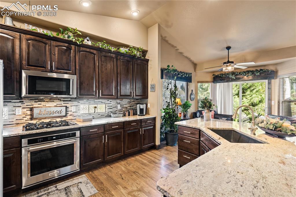 Image 12 of 36: With sitting area (also used for dining area) with access to back patio