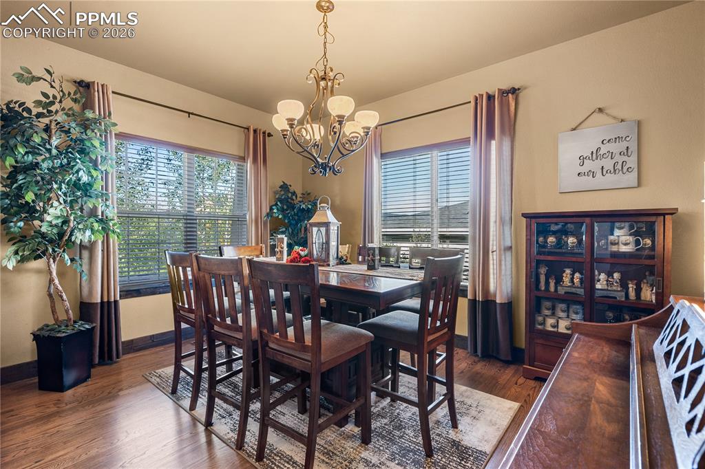 Image 6 of 36: Formal Dining room in from kitchen as you enter the home to your left