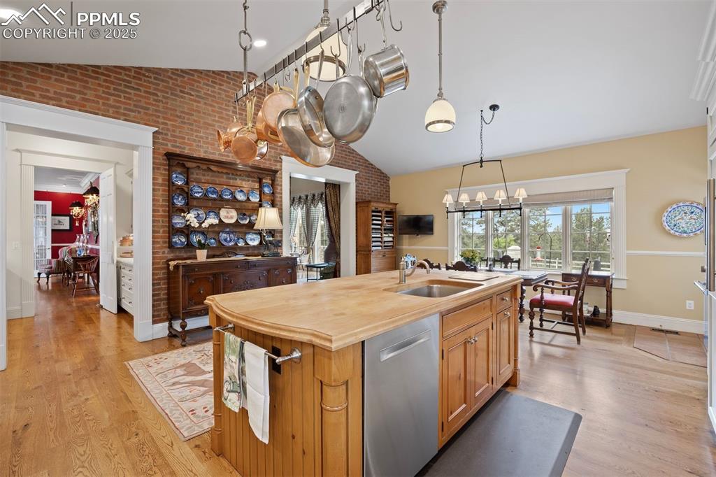 Image 12 of 49: A brick accent wall adds warmth and charm.