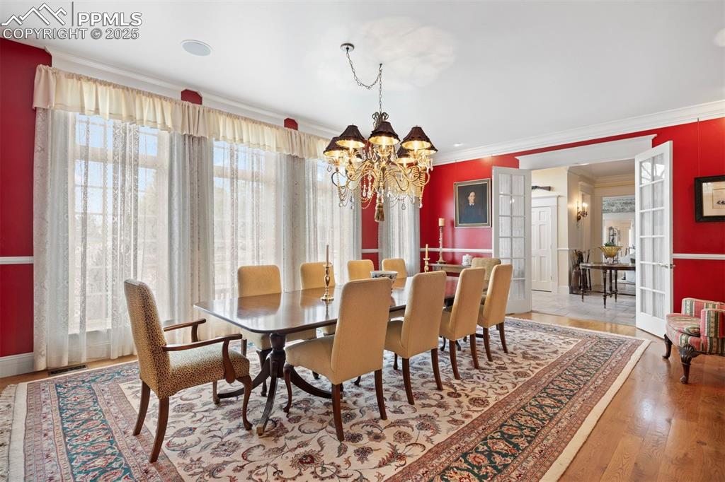 Image 15 of 49: Grand formal dining room, spacious enough to seat fourteen comfortably and 